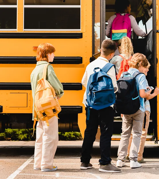 Kids getting on bus